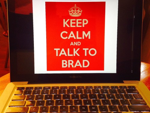 laptop screen displaying a red poster