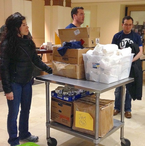 Participants in the Jews and Muslims DC event prepare to leave the DC Jewish Community Center with food and gifts for homeless people on Christmas Day.
